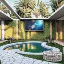 a backyard with a pool and a television
