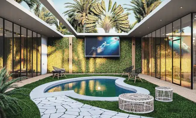 a backyard with a pool and a television